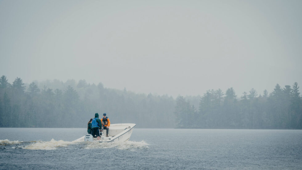 A boat with students on lower st regis lake