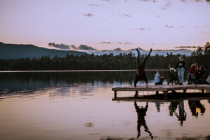 Paul Smith's student doing handstand on the dock