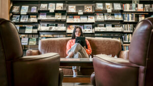 girl reading at paul smiths college library