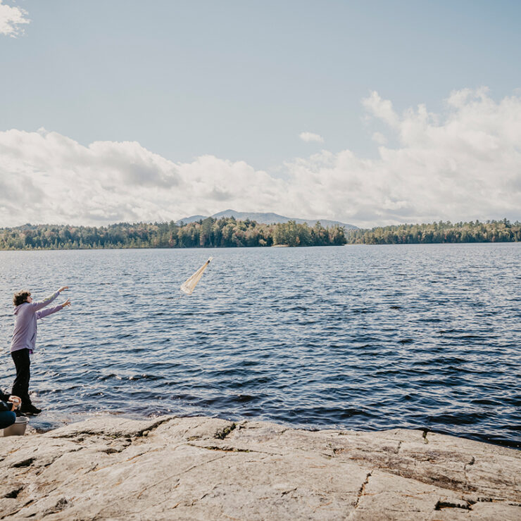 Paul Smith's students studying lakeside near the Paul Smith's College campus